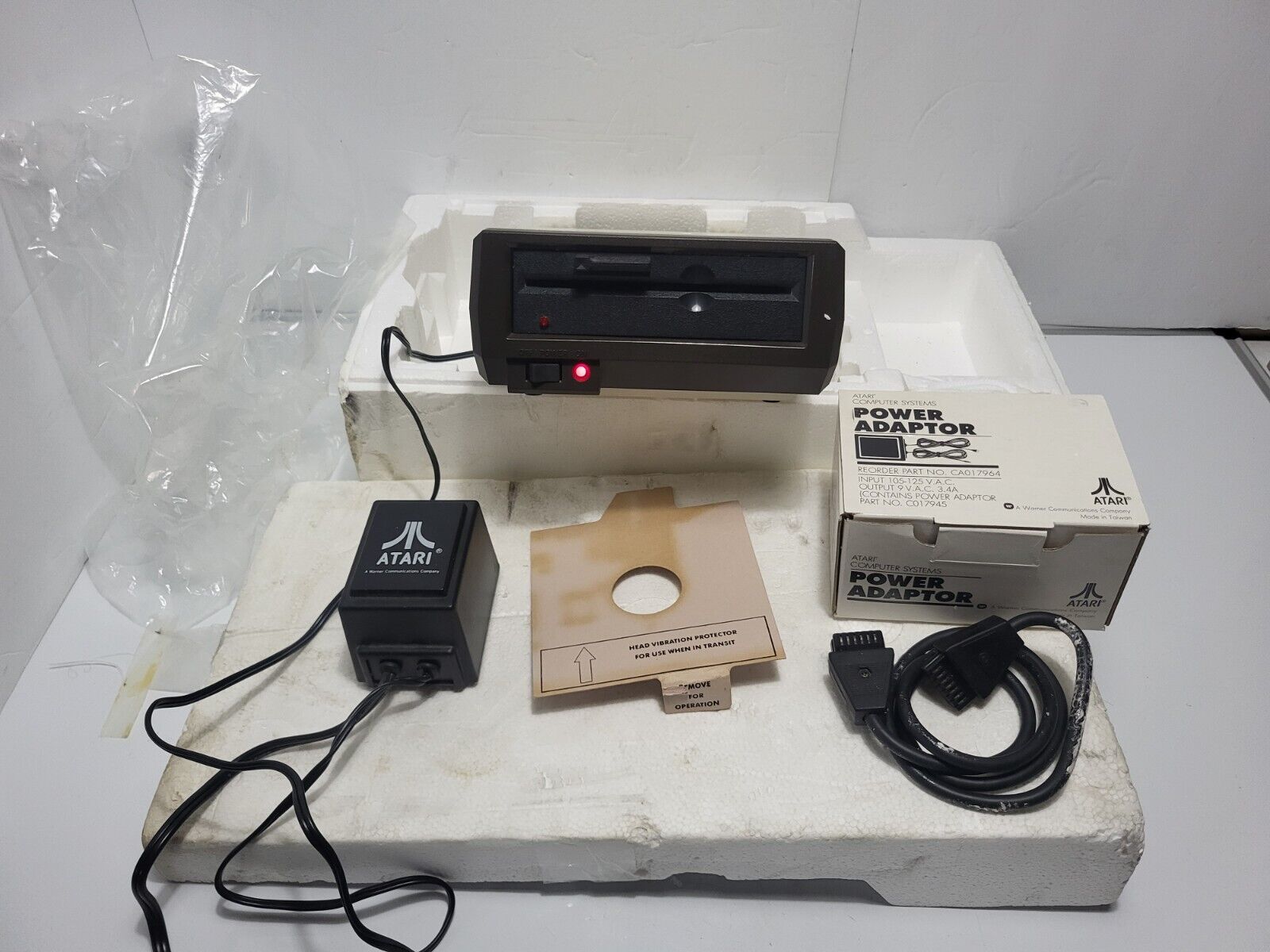 Sealed Atari 1050  Disk Drive w/ CA017964  Power Adaptor & Styrofoam Insert
